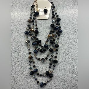Black crystal multi strand necklace with matching earrings!